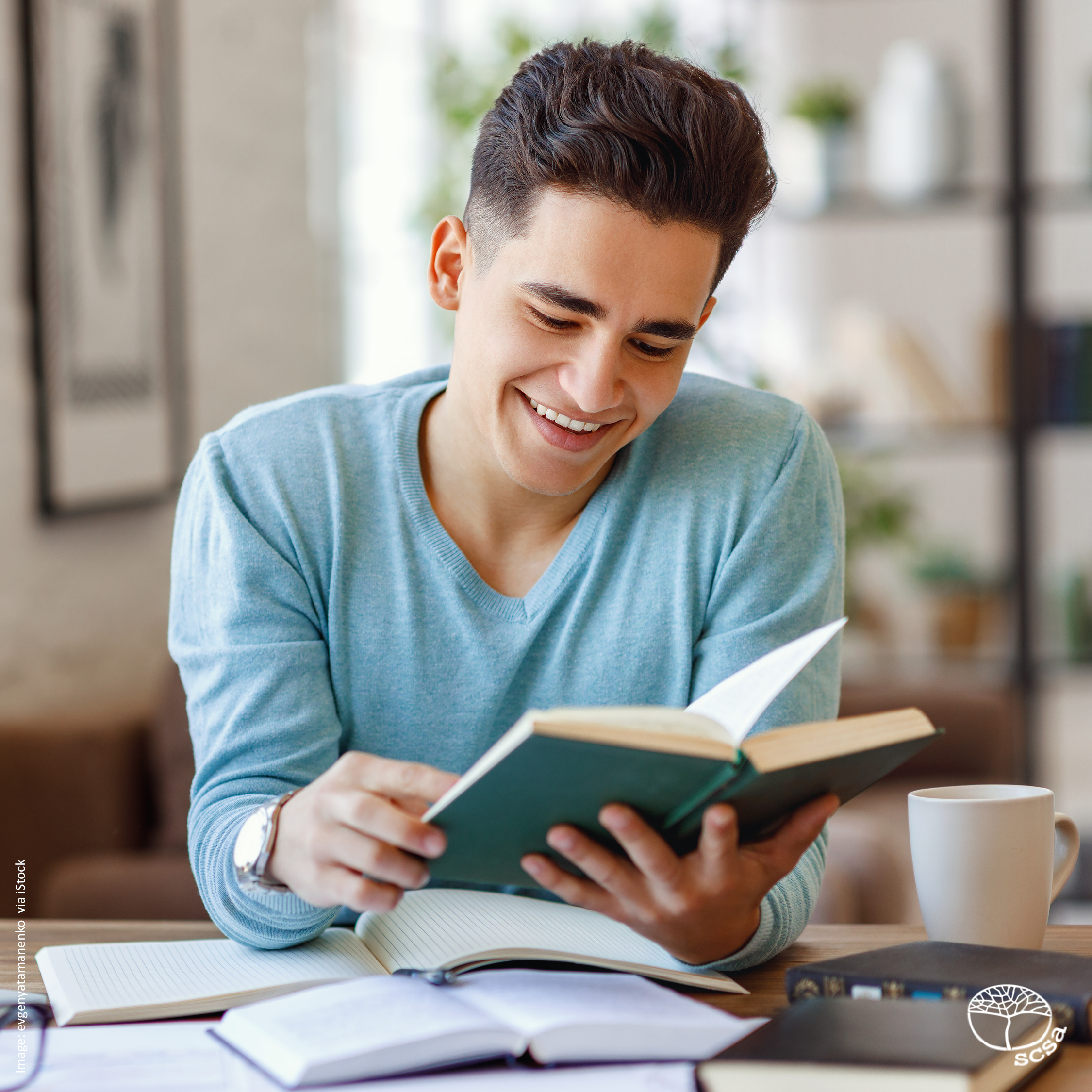 Boy happily reading